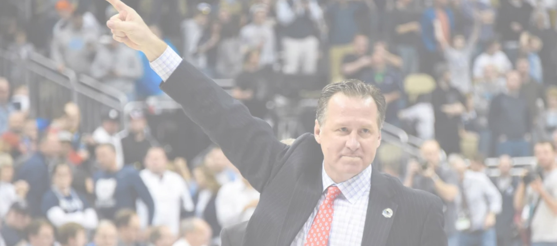 Coach Mark Gottfried pointing to fans