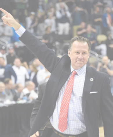 Coach Mark Gottfried pointing to fans