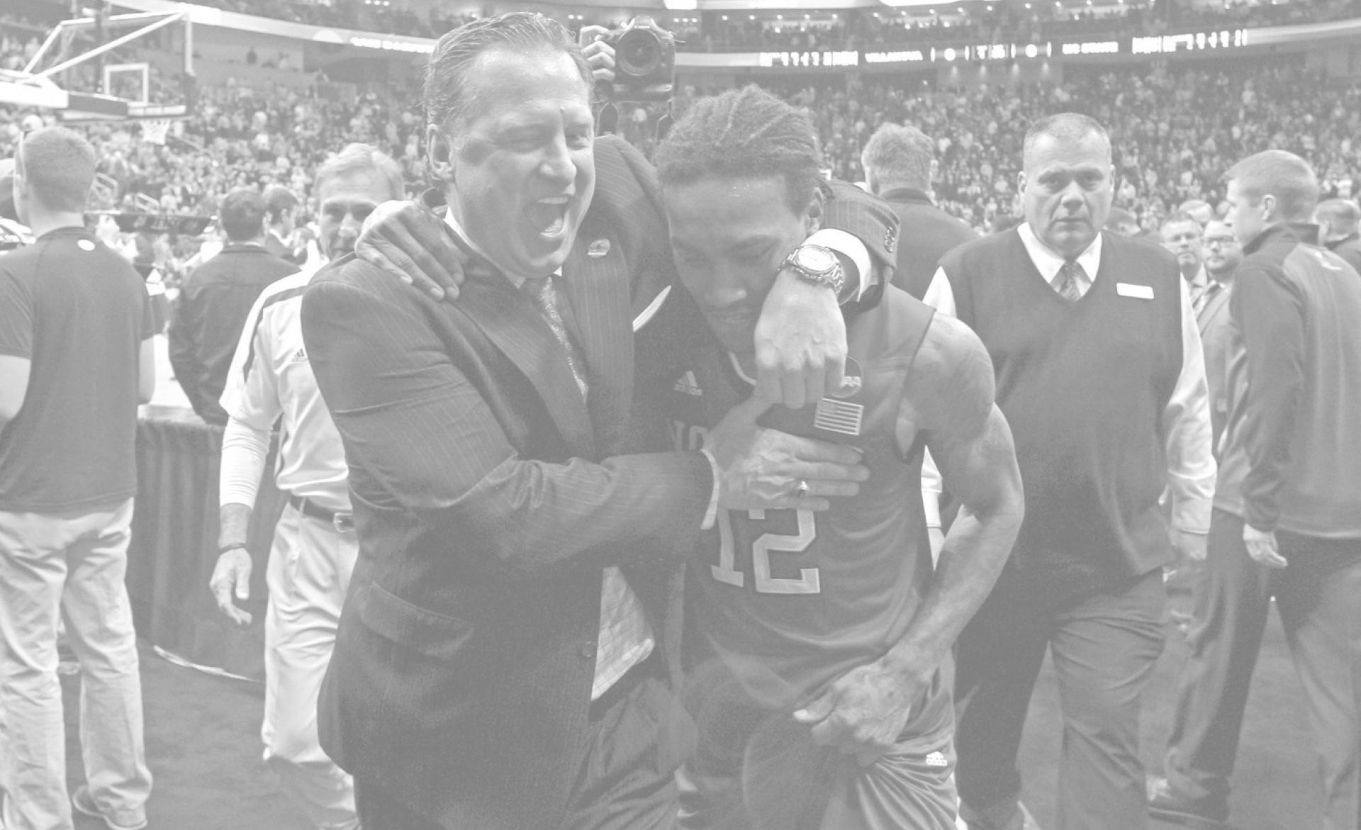 Coach Mark Gottfried hugging one of his players