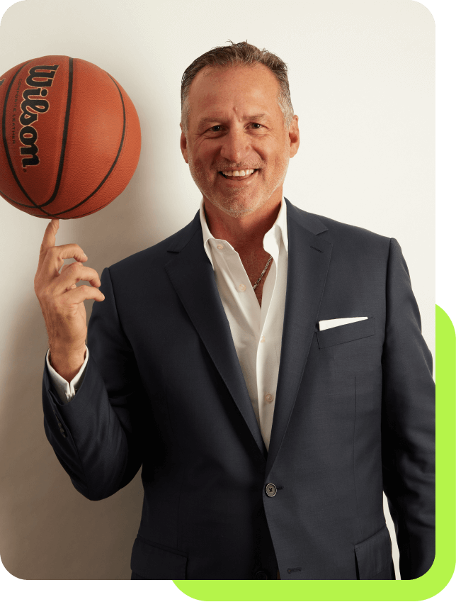 Mark Gottfried holding a basketball