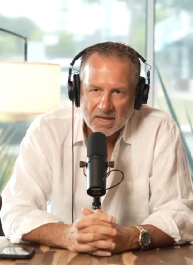 Mark Gottfried talking into a microphone