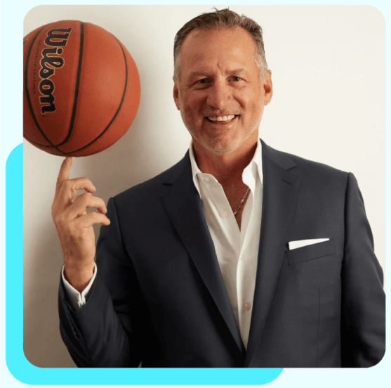 Mark Gottfried holding a basketball